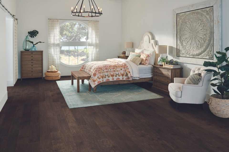 rich dark hardwood in bedroom with mid century modern vibes